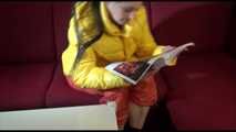 Watching sexy Lucy wearing a orange/yellow shiny nylon downwear combination reaing a magazine and lolling on the sofa (Video)