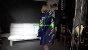 Sexy Sonja preparing her bed wearing sexy shiny nylon shorts and a long rain jacket (Video)