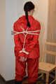 Bondage in  red nylon rainwear