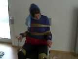 5 short Videos with Katharina tied and gagged in shiny nylon rainwear from 2005-2008