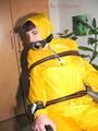 Jill tied, gagged and hooded with a tension belt on a chair wearing a supersexy yellow shiny nylon rainpants and rain jacket (Pics)