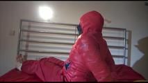 Jill tied, gagged and double-hooded on a bed wearing sexy shiny nylon rain pants and a down jacket (Video)