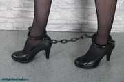 Glamour girl chained and cuffed