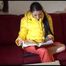 Watching sexy Lucy wearing a orange/yellow shiny nylon downwear combination reaing a magazine and lolling on the sofa (Video)