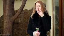 Anastasia is smoking  120mm cigarette outside