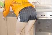 SEXY SONJA during her house work wearing sexy shiny nylon shorts and rain jacket (Pics)