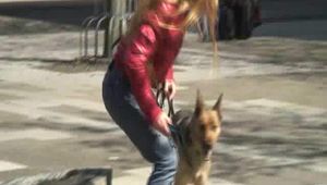 Katharina take a walk with her dog wearing a sexy red shiny down jacket (Video)