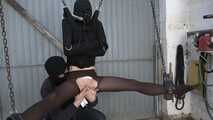 In straitjacket on chain hoist