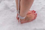 Naked barefoot Greta is tightly bound in snow - Photos