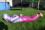 Watch Sandra beeing bound and gagged in her shiny nylon Downwear in the Garden