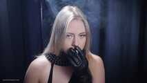 Blonde is smoking in a black leather gloves