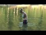 Jenny bathing in a lake and sun bathing wearing sexy darkblue shiny nylon shorts and a bikini-top (Video)