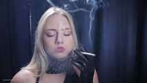 Blonde is smoking in a black leather gloves