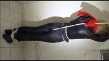 Pia tied, gagged and hooded in a cellar overhead wearing shiny nylon rainwear in black (Video)