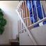 Mara tied and gagged with cuffs on a stairway wearing shiny nylon rainwear (Video)