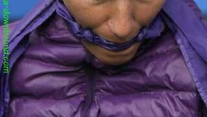 Watch Sandra beeing bound gagged and hodded in her shiny nylon Downjacket