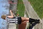 Watching Pia sweeping the terrace wearing a sexy black shiny nylon shorts, a striped top and black rubber boots (Pics)