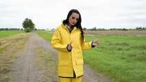 Miss Amira on the road in a Frisian mink, yellow rain dungarees and rubber boots