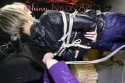 Watching sexy Sonja being tied and gagged from another woman both wearing shiny nylon rainwear (Pics)