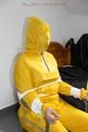 Jill tied and gagged on a chair wearing a yellow rainsuit and coveres with an yellow raincoat with two hoods (Pics)