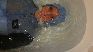 Watching Stella being tied and gagged with ropes and a cloth gag in a bathtub diving under water (Pics)