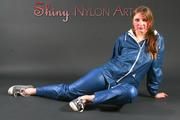 Beautiful archive girl posing in a photostudio wearing a supersexy AGU shiny nylon bib and rain jacket (Pics)