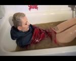 Mara wearing a sexy shiny nylon shorts and a rain jacket enjoying mud in her bath tub (Video)