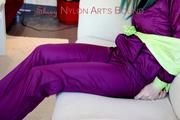 Mara tied and gagged with cloths on a sofa wearing a sexy purple shiny nylon rainwear (Pics)