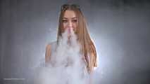 Ksenia is making a lot of nose exales while smoking vape