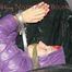 Sandra tied and gagged on a sofa with cuffs and a pillory wearing hot purple down jacket and black down pants (Pics)