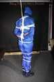 Watching sexy Pia being tied and gagged overhead with ropes and a ballgag wearing a supersexy blue shiny nylon bib overall and a rain jacket (Pics)