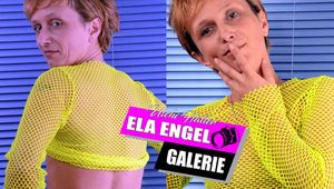 Ela Engel in the studio with yellow fishnet shirt