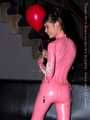 A babypink latex catsuit with Emma and a wet diaper inside