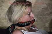 Watching Pia loling around her bed being tied and gagged with ropes amd a cloth gag (Pics)