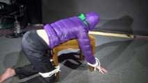 Watching Sonja wearig a sexy blue rainpant and a purple down jacket being tied, gagged and hooded on a stool with ropes and a cloth gag (Video)