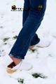 Linda with white clogs in the snow