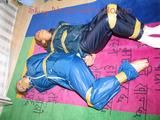 Stella and Leonie tied and gagged and hooded with tape both wearing sexy shiny nylon rainwear (Pics)