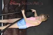 Watching ***MIA*** wearing a hot lightblue shiny nylon shorts and a pink top during vacuuming the studio (Pics)