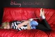 Watching ***PIA*** wearing a sexy lightblue shiny nylon shorts over a black leggings and a black/white striped top being tied and gagged with ropes and a clothgag (Pics)