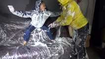 Watching sexy Stella and Sandra having fun with shaving cream and eachother both wearing shiny nylon rainwear (Video)