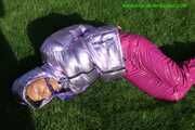 Watch Sandra beeing bound and gagged in her shiny nylon Downwear in the Garden