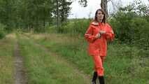 Miss Petra takes a walk in a orange AGU rain suit and rubber boots