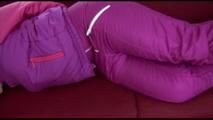 Jill tied and gagged on a red sofa wearing an oldschool shiny nylon downwear skibib (Video) 