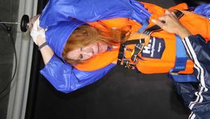 See Ronja tied and gagged by Stella in shiny nylon Rainwear and a Life Vest! Part 2