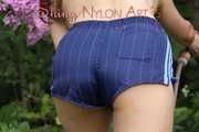 Watching Aiyana wearing only a sexy blue shiny nylon shorts watering the garden (Pics)