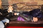 Mara tied and gagged on a princess bed in an old cellar wearing an supersexy shiny purple down jacket and a rain pants (Pics)