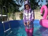 Watch Sandra enjoying her shiny nylon Downwear at a warm Summer Day in the Garden and in the Pool
