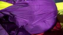 Watching sexy Sonja weraing a sexy down skirt and a down jacket putting on a sexy purple rainsuit (Video)