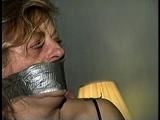 43 YEAR OLD WAITRESS IS TAPE HOG-TIED, BAREFOOT, TOE-TIED & WRAP TAPE GAGGED (D65-8)