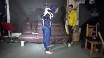 Sandra tied and gagged overhead with ropes and a ballgag overhead prepared to be hunged up by Stella both wearing sexy shiny nylon rainwear (Video) 